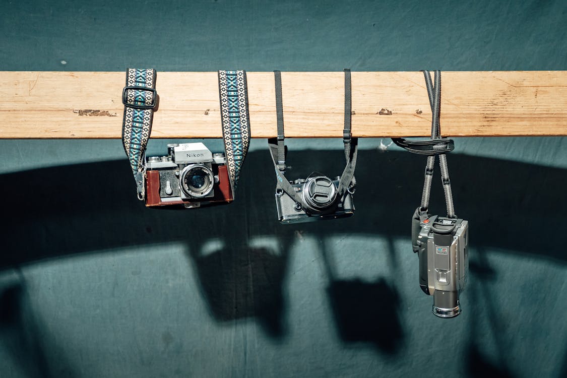 Vintage Cameras Hanging Display in Studio · Free Stock Photo