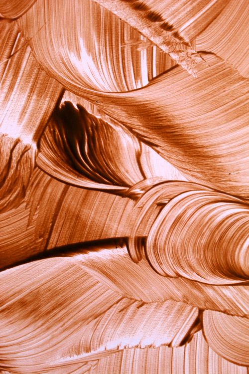 Free Close-up of vibrant orange brushstrokes, creating a dynamic abstract texture. Stock Photo