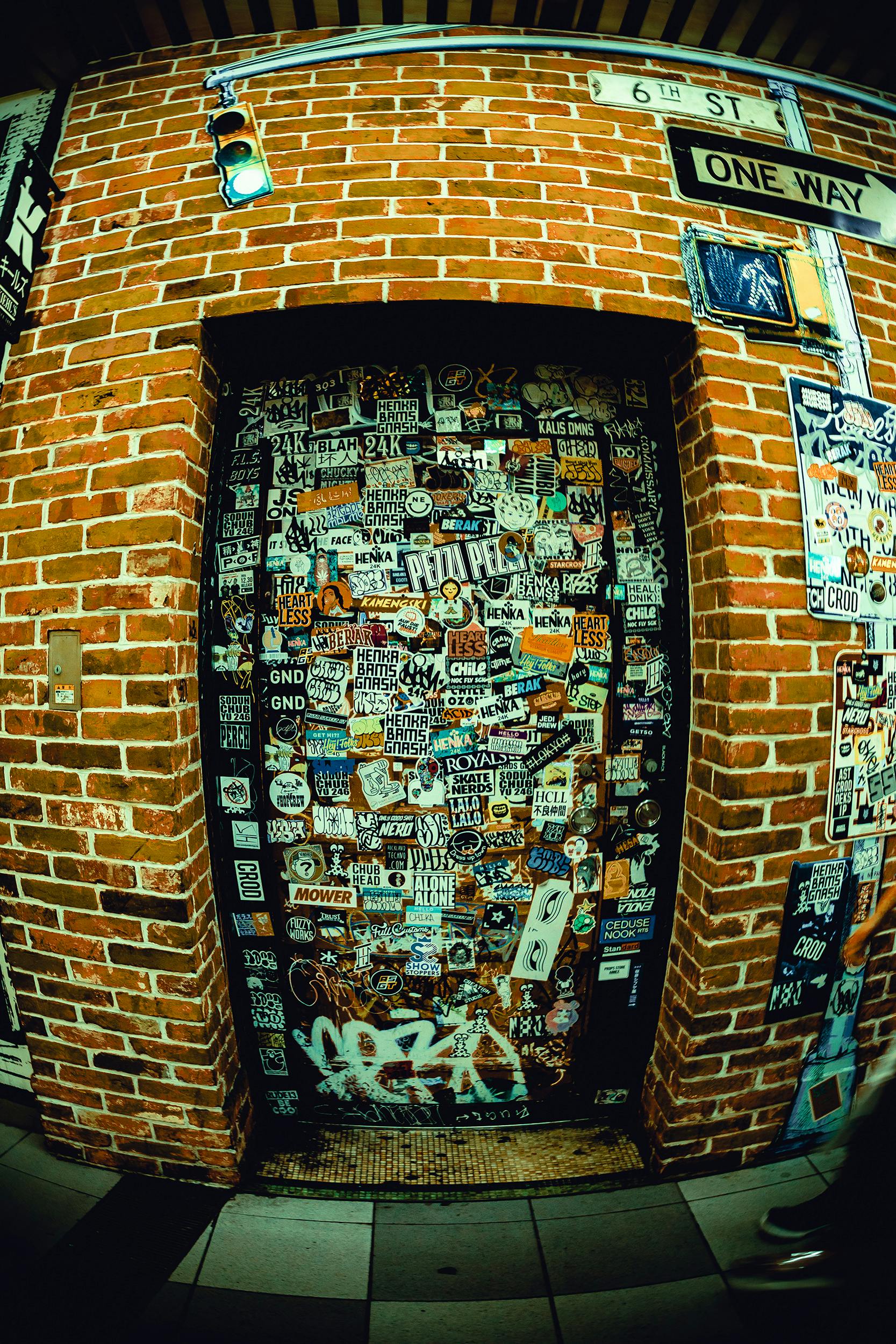 Hands applying travel vintage sticker to suitcase