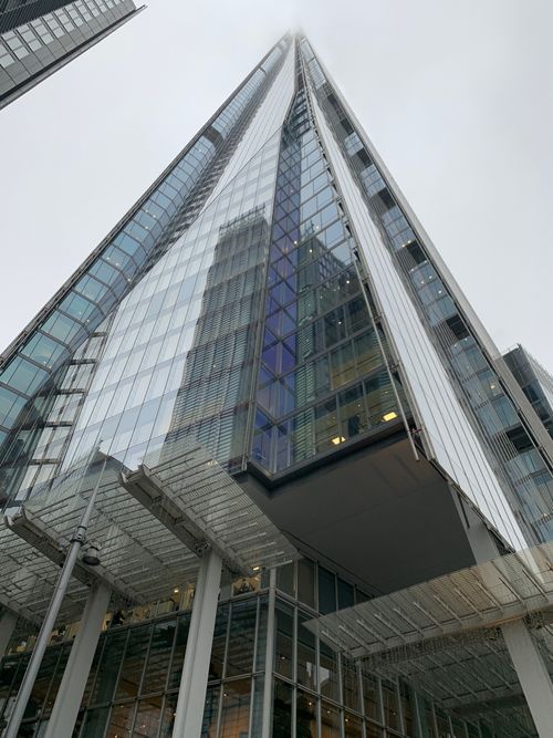 Free A view of The Shard in London, an iconic skyscraper under a cloudy sky, showcasing modern architecture. Stock Photo