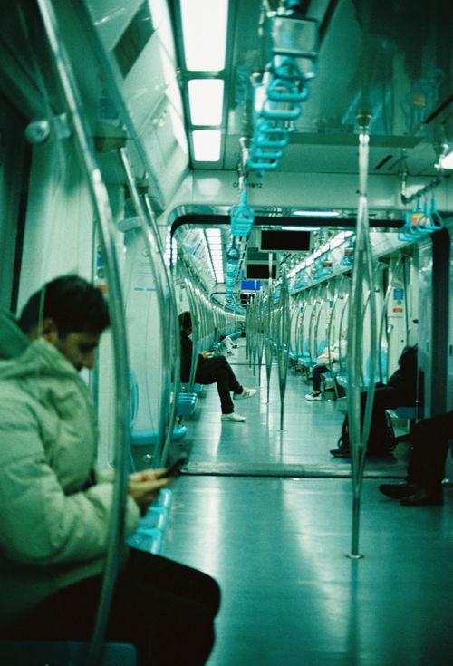 Free Minimalist view of a subway with passengers during the day, calm atmosphere. Stock Photo