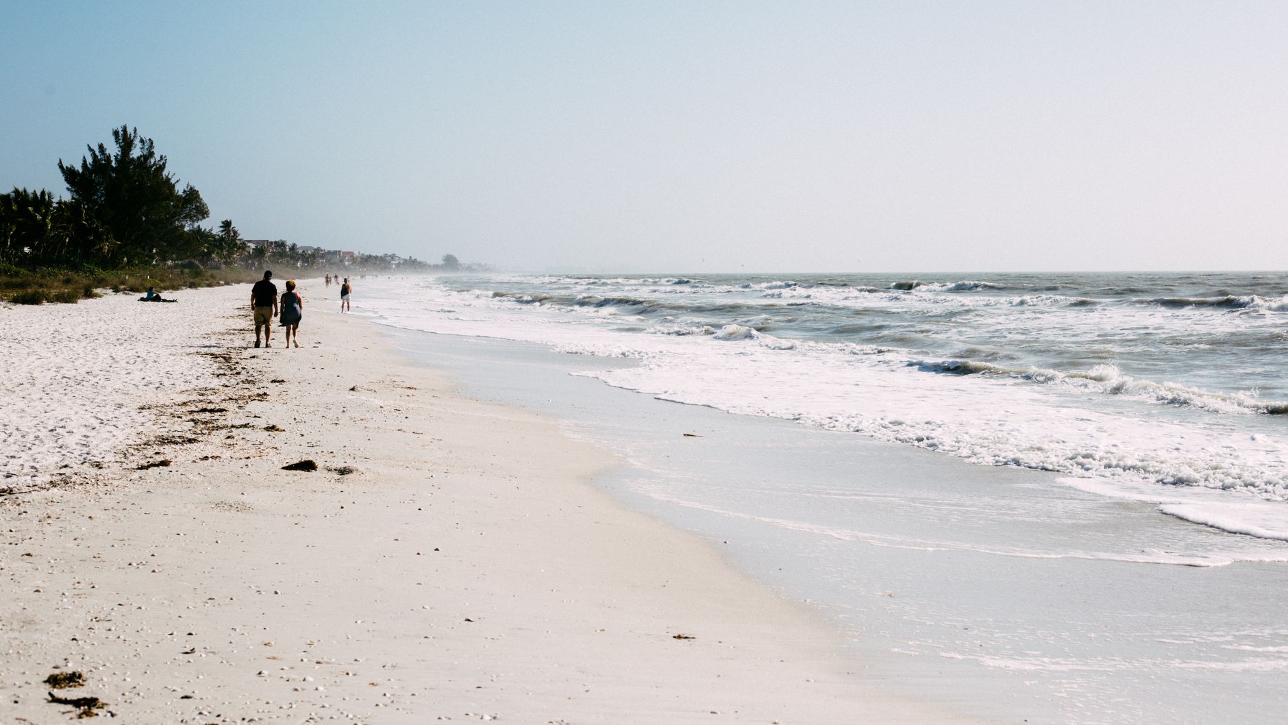 Peaceful seaside stroll along the sandy shores of Bonita Springs, Florida.