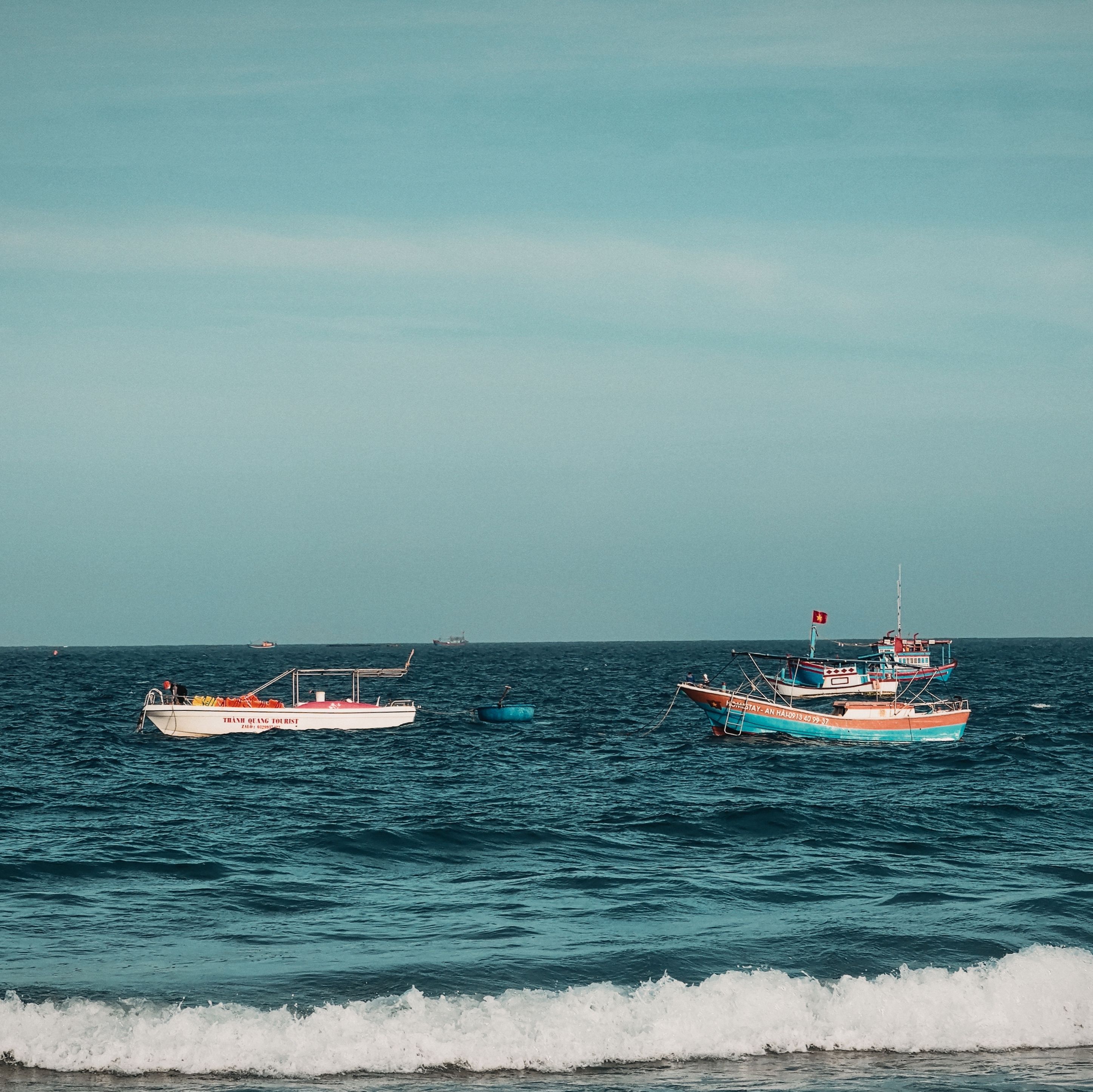 Serene view of traditional fishing boats on the coastal waters of Phú Yên, Vietnam, capturing maritime life.