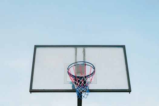 Basketball hoop and backboard against a clear blue sky in Zapopan, Mexico.
