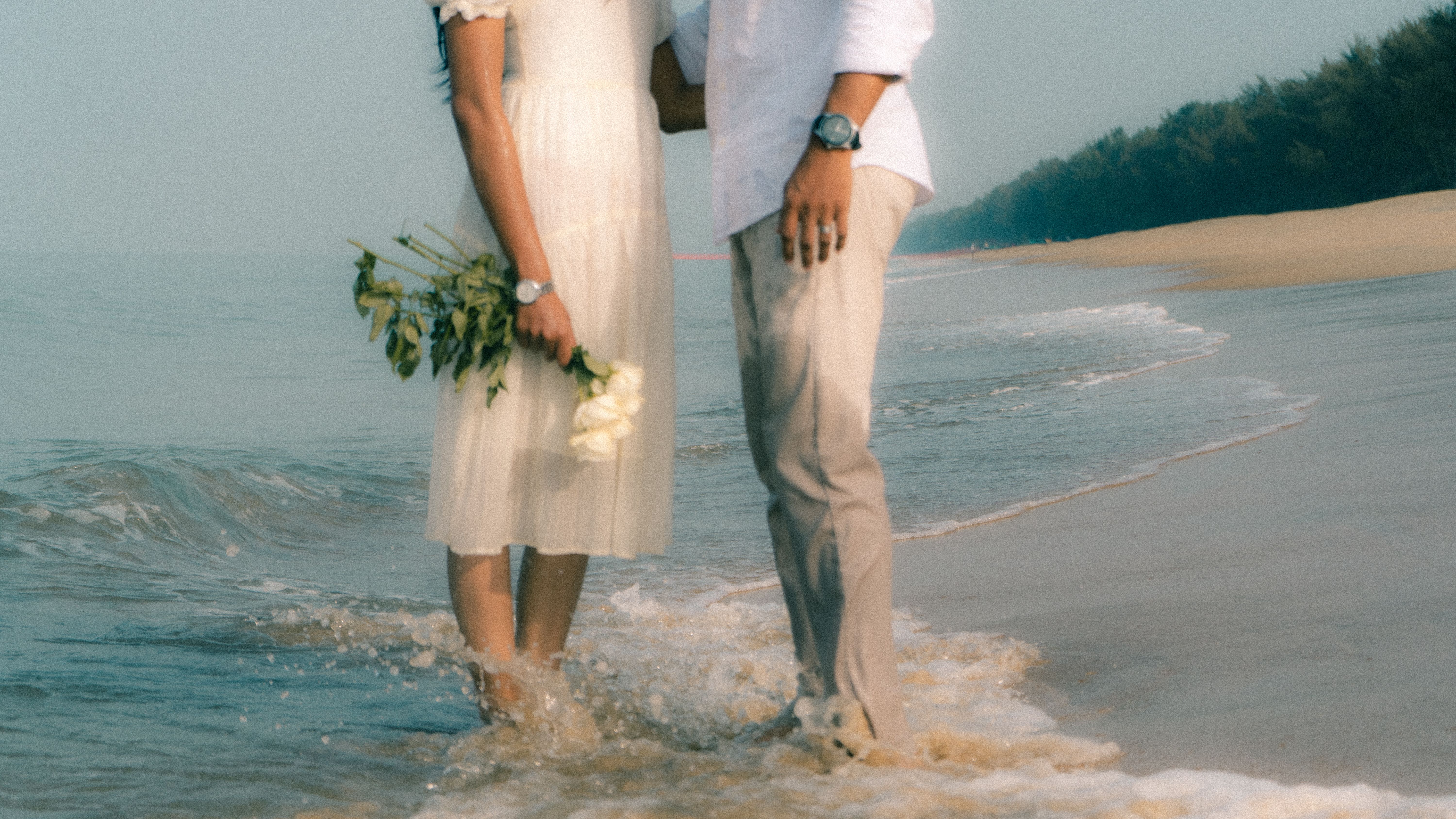 Romantic Couple Embracing on a Beach at Sunset · Free Stock Photo