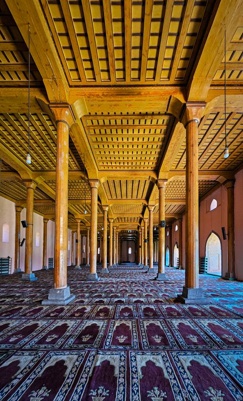 Free Explore the stunning wooden columns and ceiling of a mosque in Srinagar, reflecting Islamic architecture. Stock Photo