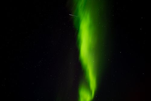 Free Captivating display of aurora borealis with bright stars at night in Islandija. Stock Photo