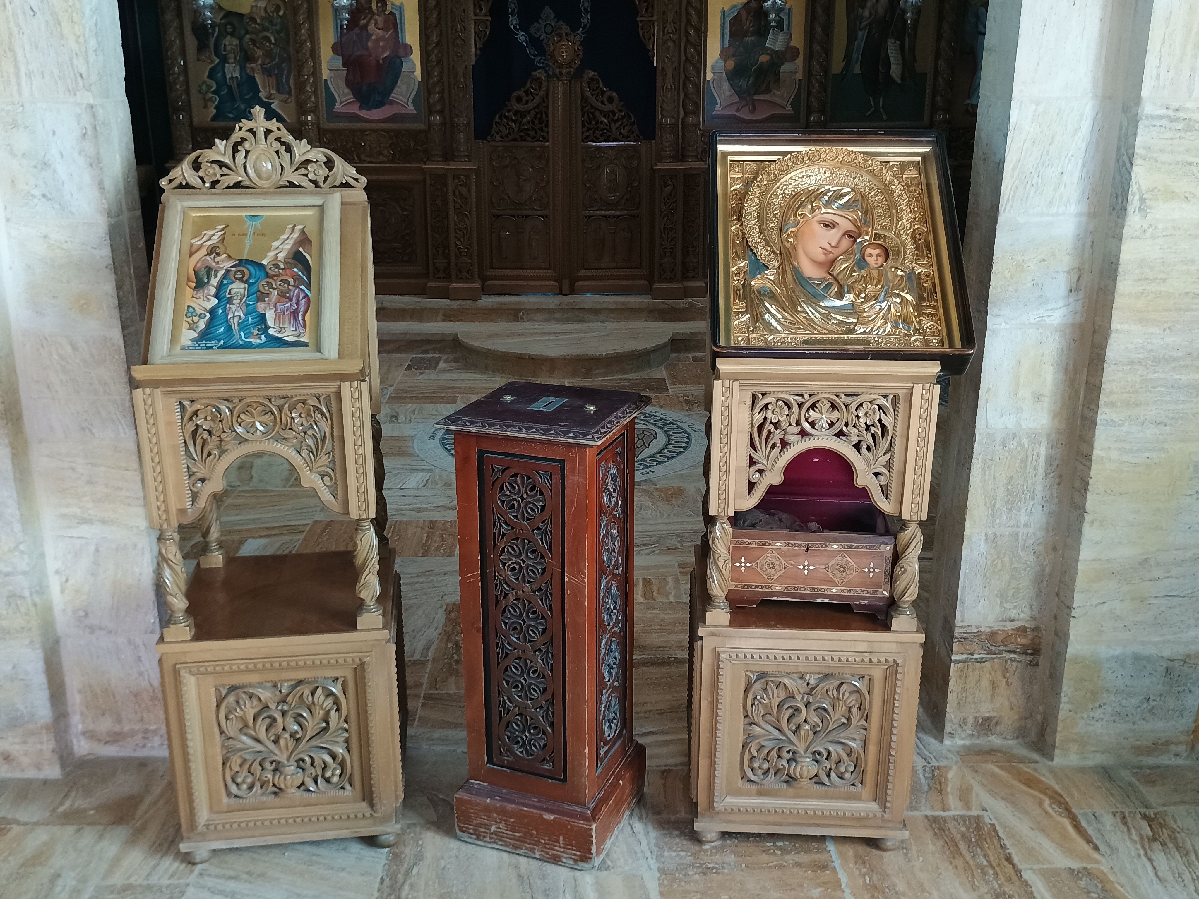 Intricately carved religious icons in a church setting in Madaba Governorate, Jordan.