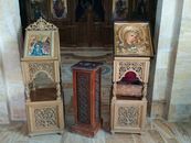 Intricately carved religious icons in a church setting in Madaba Governorate, Jordan.