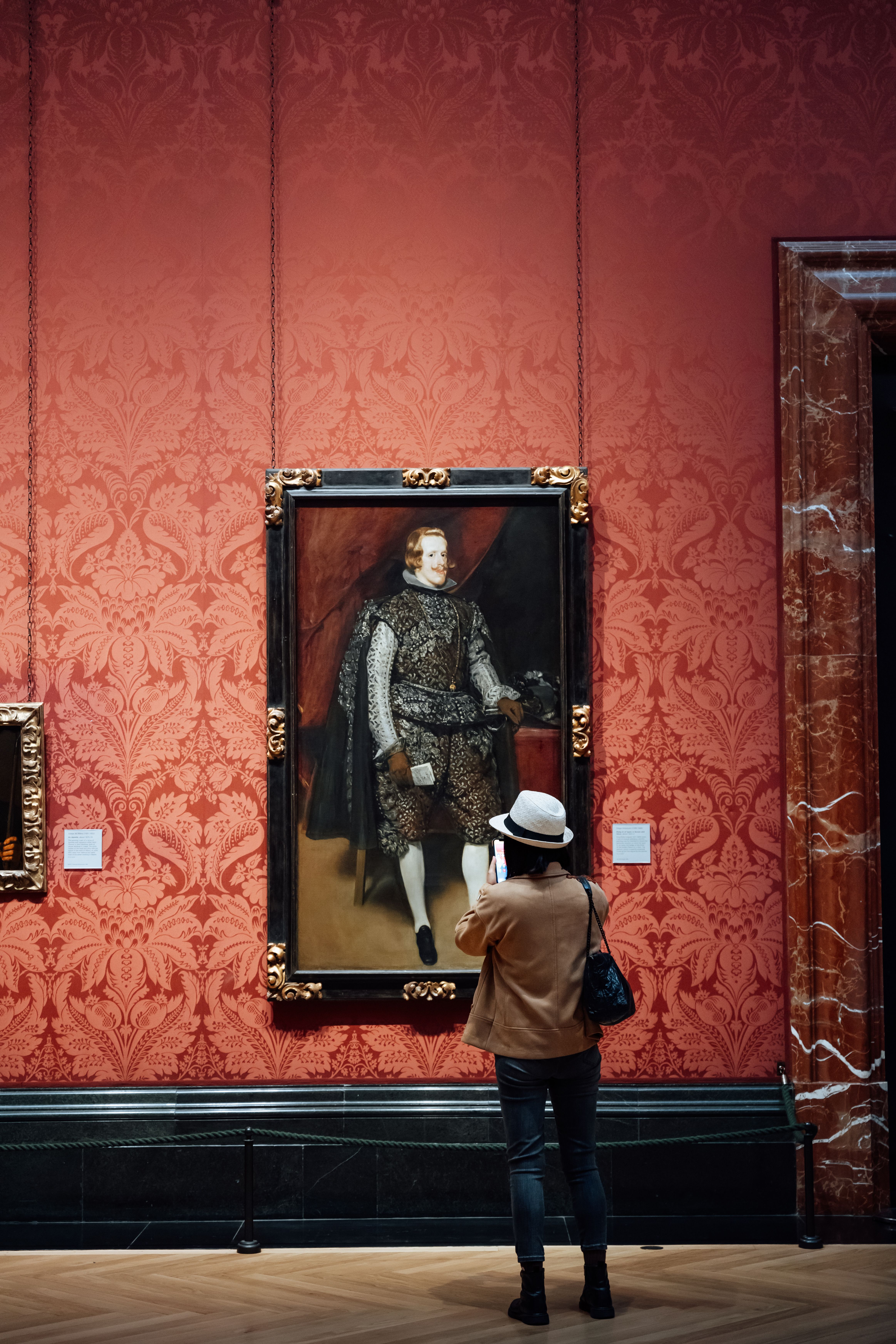 art-enthusiast-admiring-historical-portrait-free-stock-photo