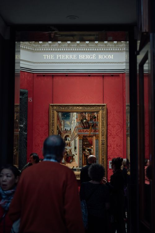 Free People admire classic artwork in the Pierre Bergé Room, England. Stock Photo