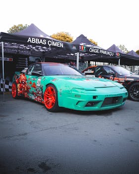 Vibrant custom Nissan car displayed at Ankara Auto Show. Eye-catching design and colors.