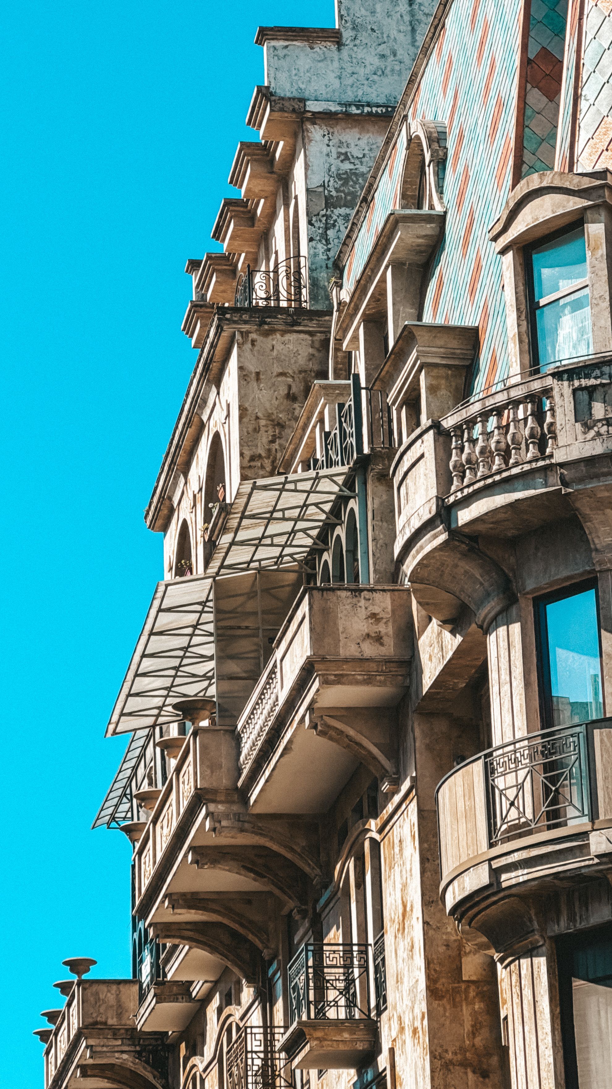 Historic Building Facade with Balconies · Free Stock Photo