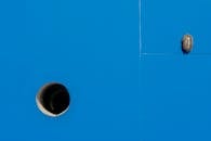 Minimalistic Blue Surface with Beetle and Pipe