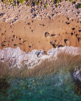 A stunning aerial shot of the sandy beach and waves in Porto do Son, Galicia, Spain.