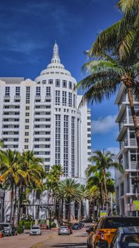 Captivating view of Miami Beach's architectural beauty amidst palm trees and lively streets.
