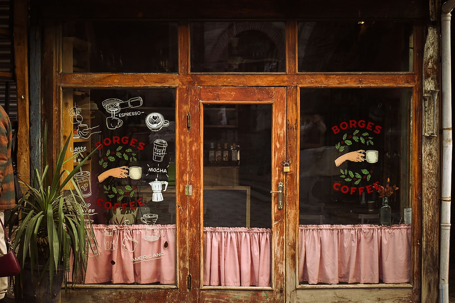 Cozy coffee shop with wooden facade and vintage decor in Ankara, Türkiye.