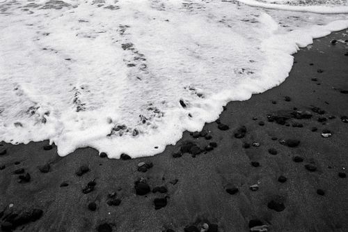 Free Monochrome capture of wave foam on a rocky shoreline at Şile, Istanbul. Stock Photo