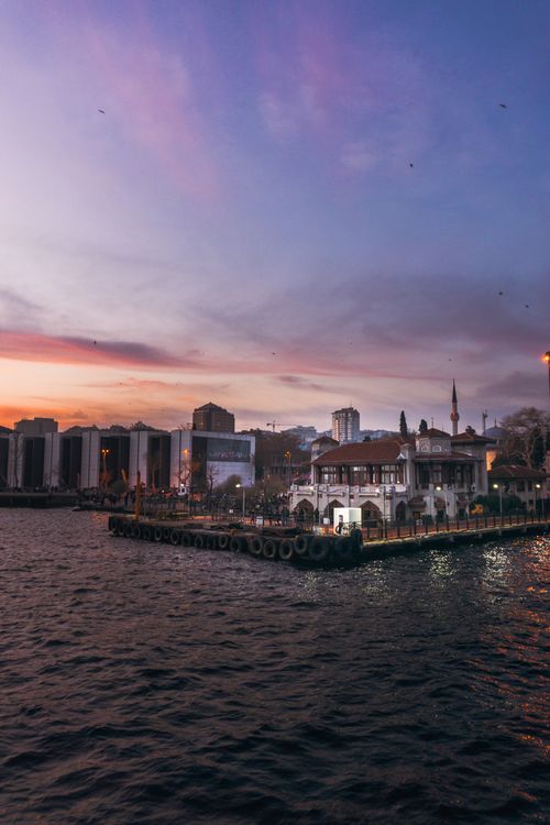 Free Scenic sunset over İstanbul's waterfront, capturing serene sky and city lights. Stock Photo