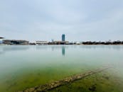 Modern Skyline by Calm Reflective Lake in Tianjin