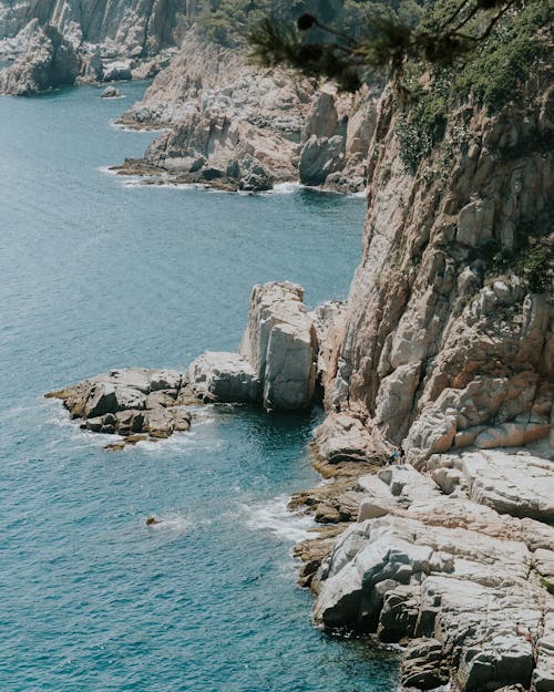 Aerial Shot Of A Rocky Mountain Cliffs By The Sea