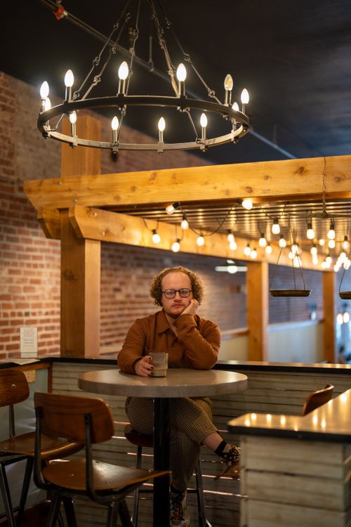 Free Man enjoying coffee in a rustic Stillwater, OK cafe. Stock Photo