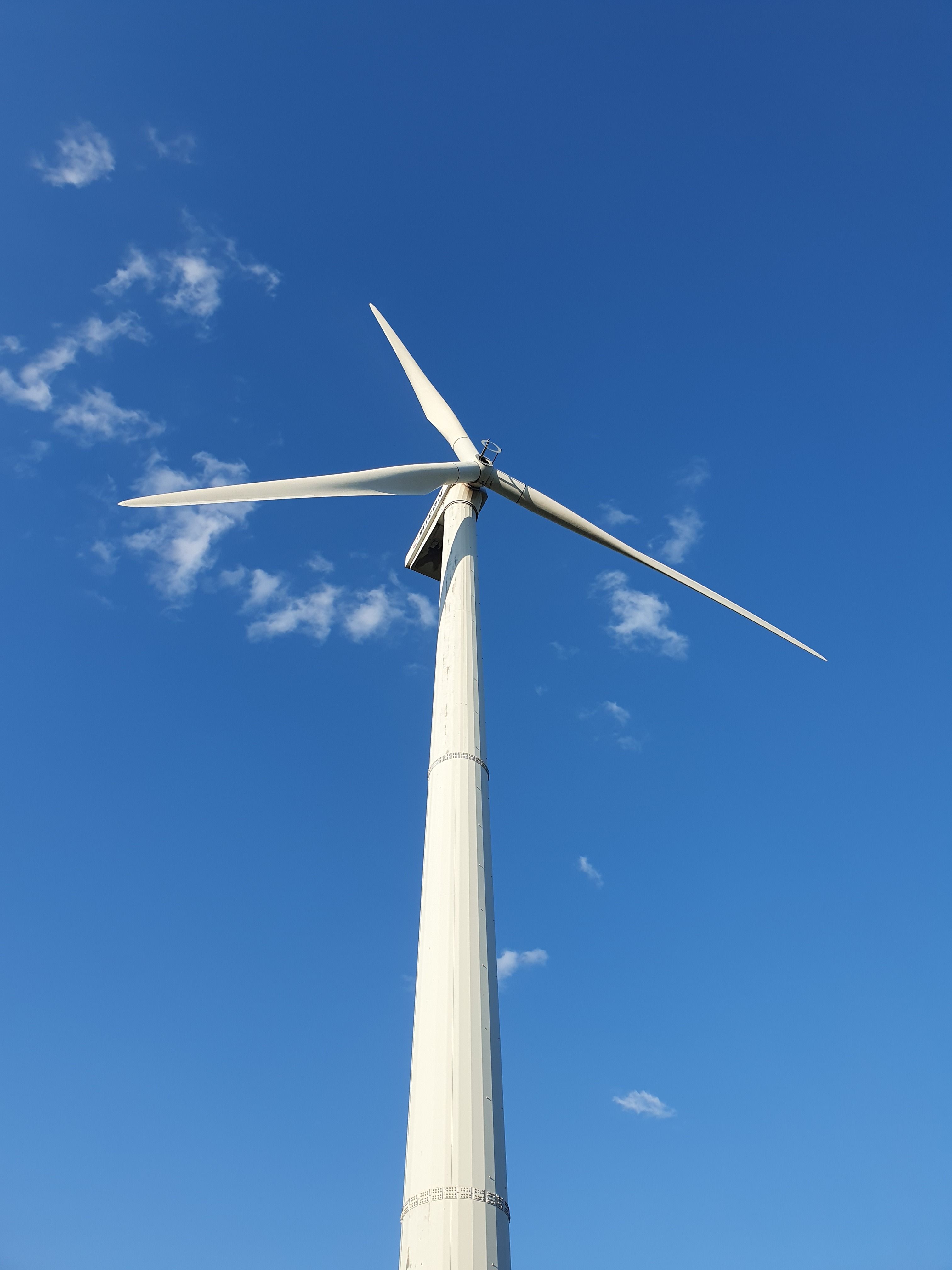 Large Wind Turbine Against Blue Sky · Free Stock Photo