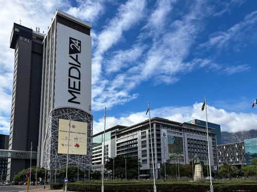 Free Urban cityscape featuring the prominent Media24 building in Cape Town with clear skies. Stock Photo