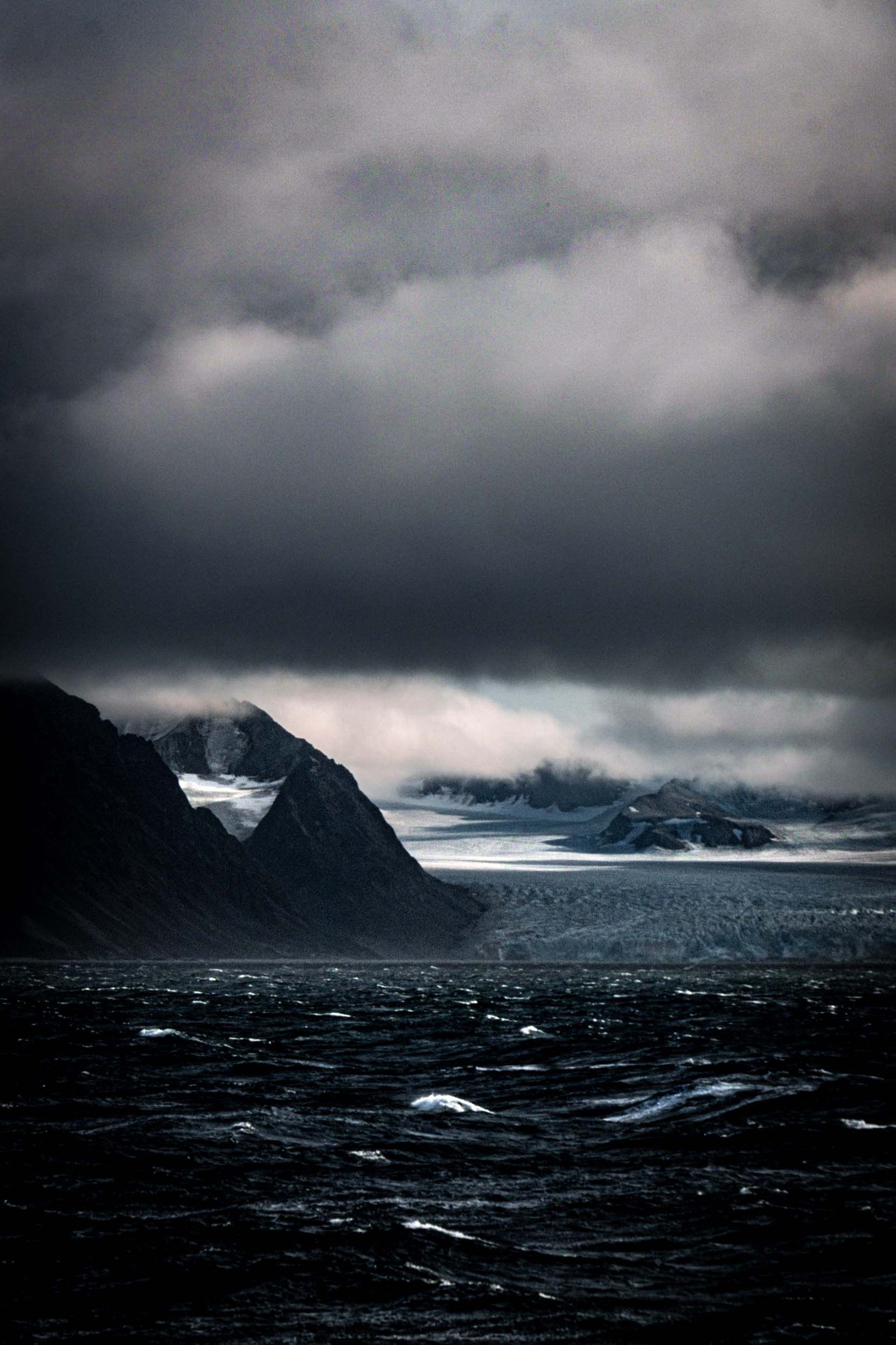 Dark moody ocean landscape with stormy skies