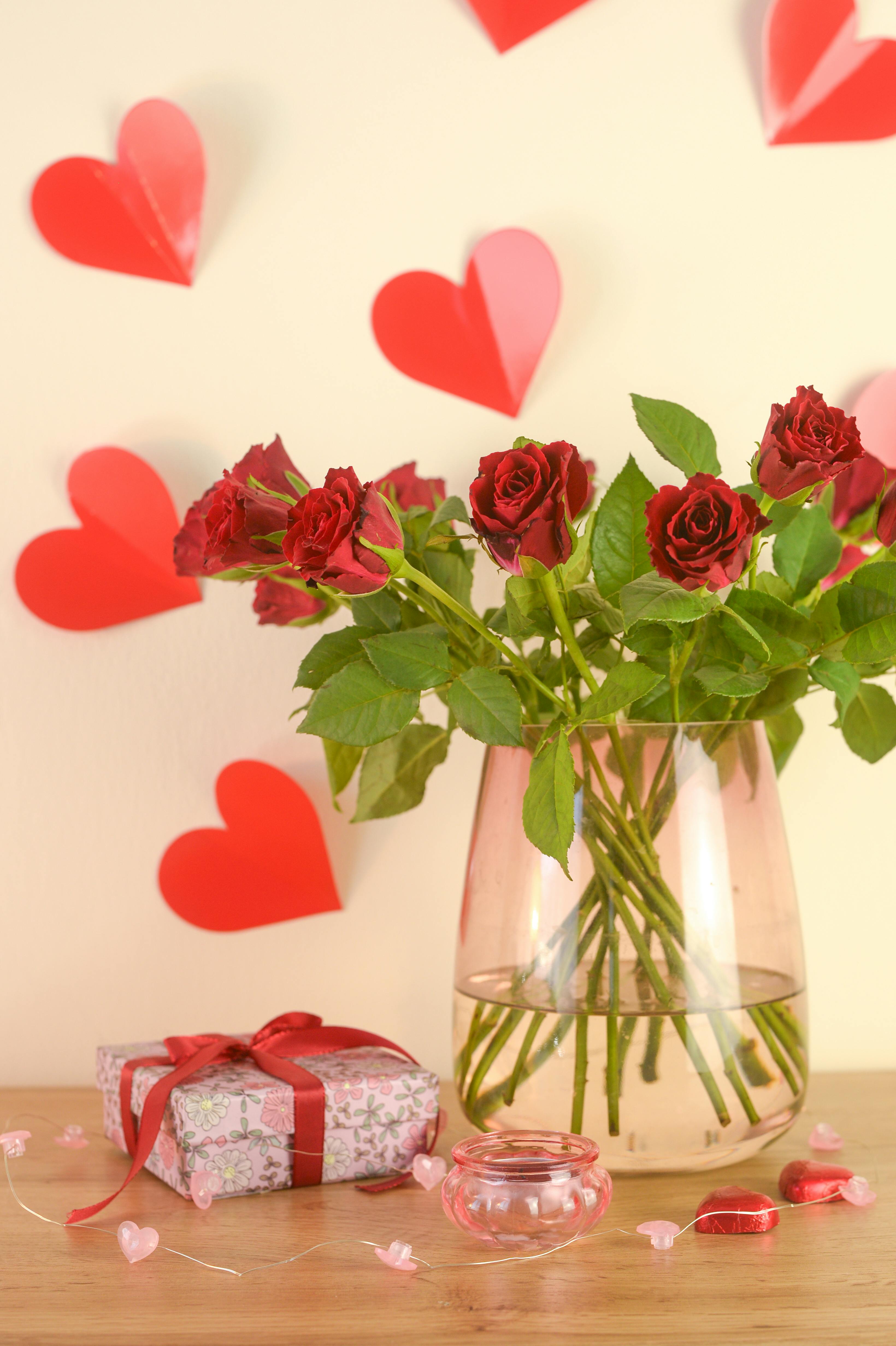 Lovely rose arrangement with hearts, perfect for Valentine's Day decor.