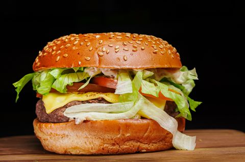 Cheeseburger with lettuce, tomato and onion — photo by pedro furtado on Pexels