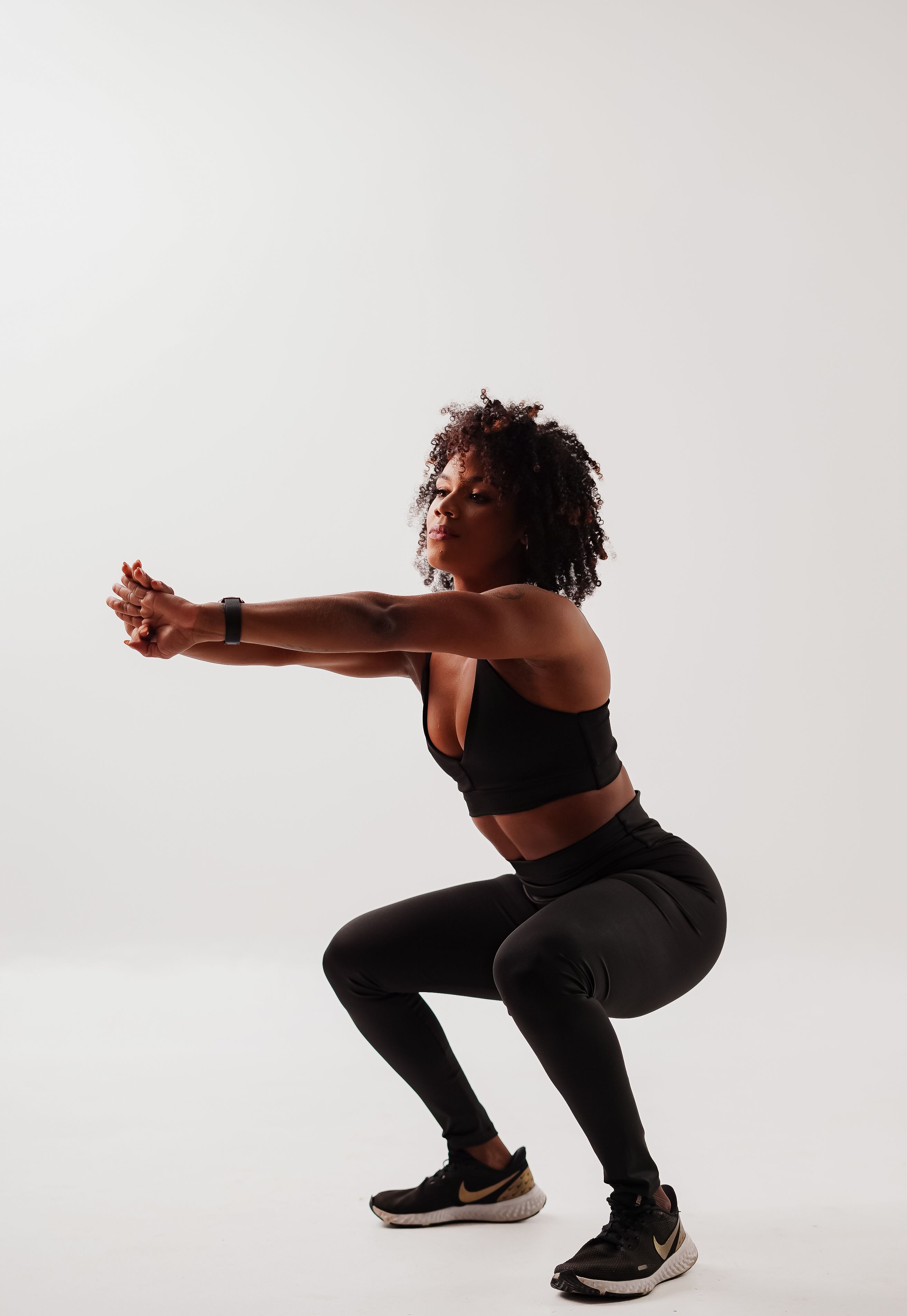 Woman performing a HIIT workout at home
