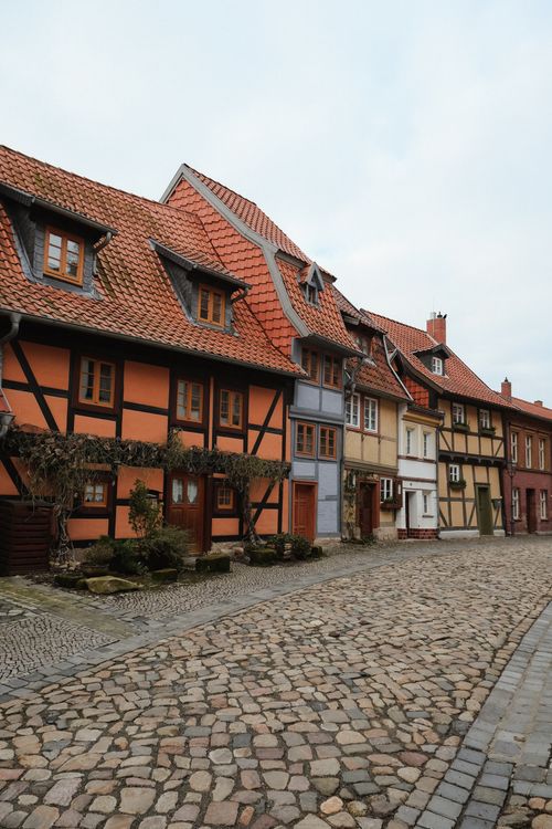 Free Quaint half-timbered houses line the cobblestone streets of Quedlinburg's old town. Stock Photo