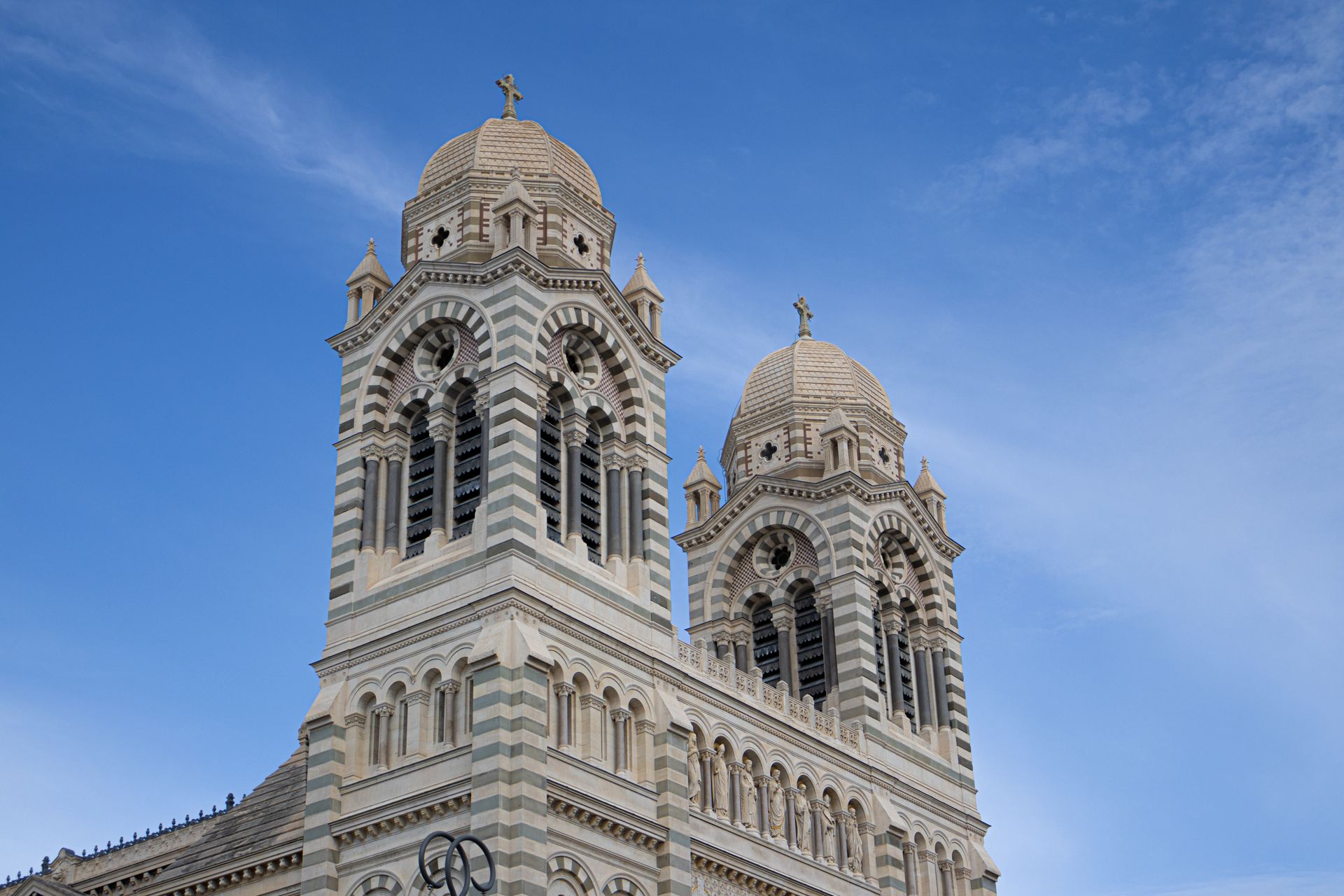 Majestic view of Cathédrale de la Major's iconic architecture in Marseille under a clear sky.