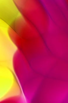 Bright abstract background with vibrant pink and yellow gradient waves.