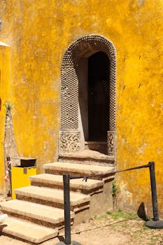 Close-up of a textured stone doorway at Pena Palace, Sintra, Portugal.
