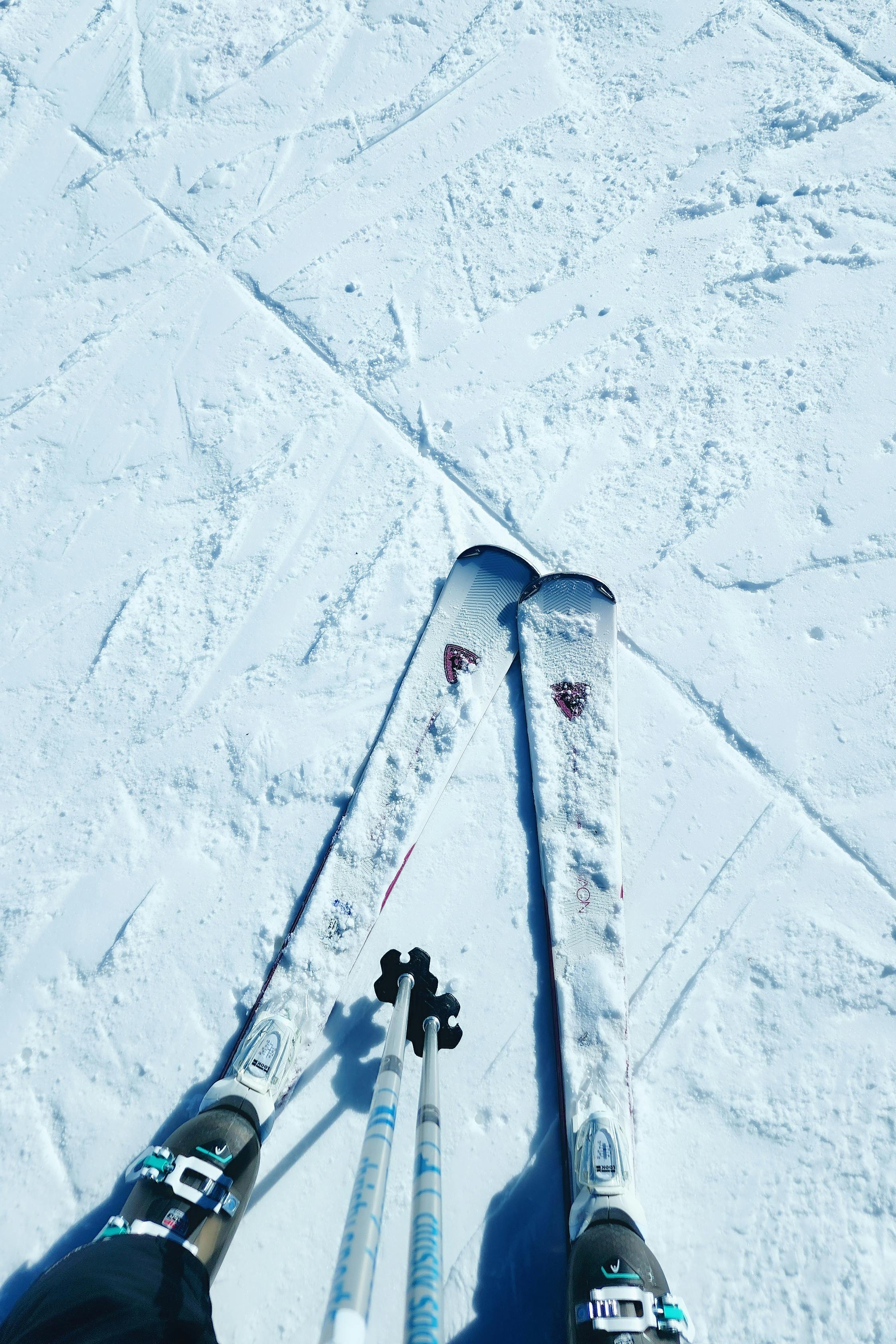 Close-up of ski tips on snowy ground, capturing winter sports in Granby, Colorado.