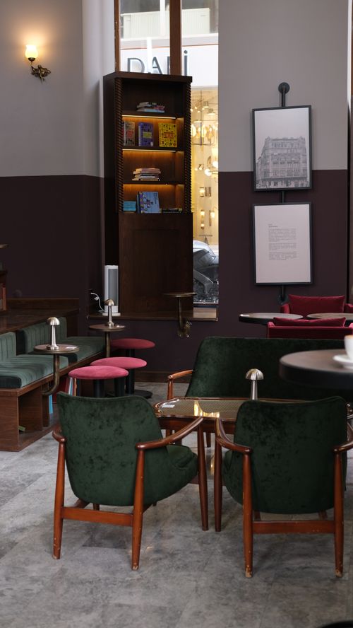 Free A cozy café in Istanbul with elegant mid-century modern furniture and a warm atmosphere. Stock Photo