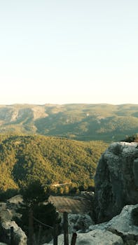 Explore a stunning rocky mountain landscape bathed in warm light.
