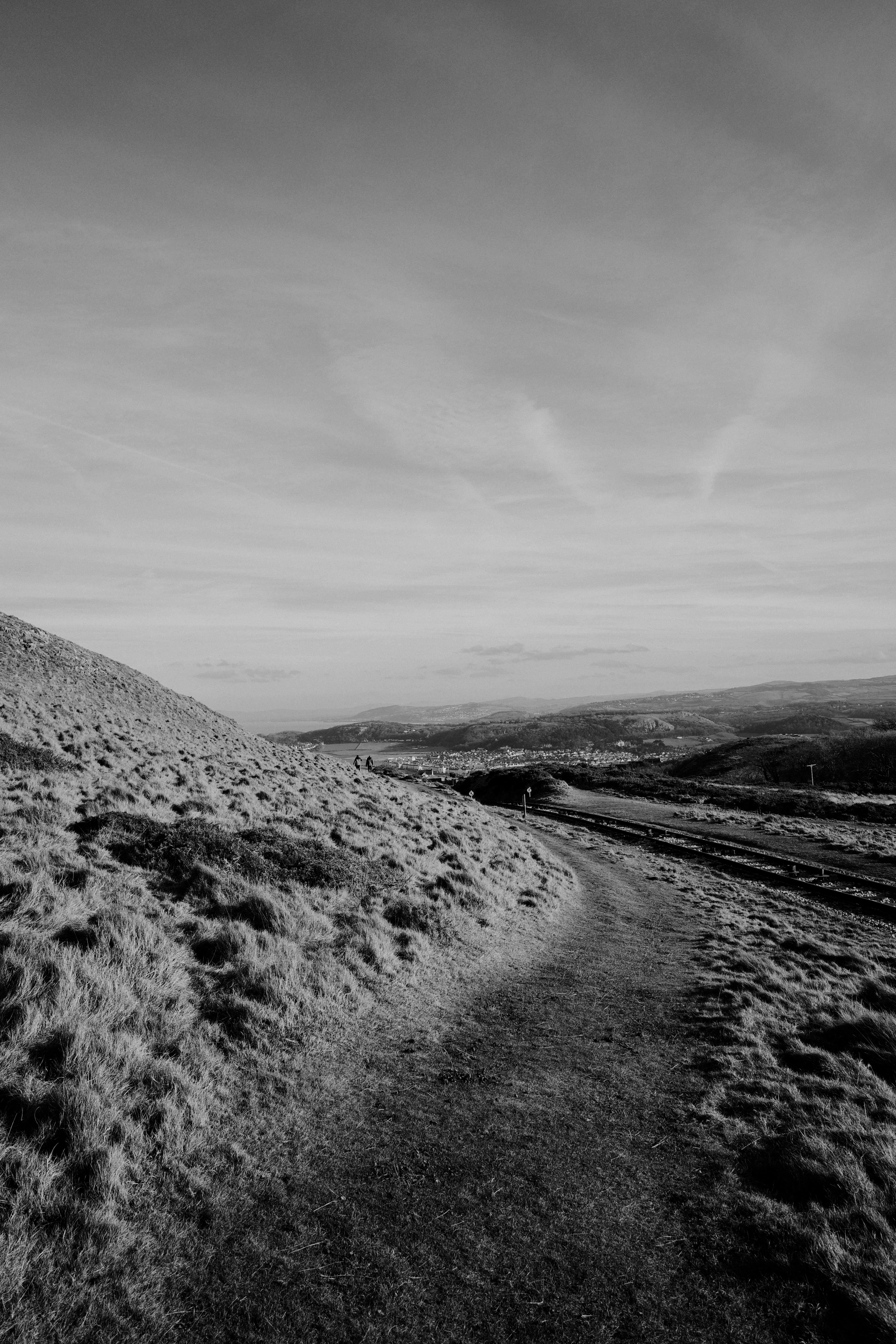 Explore the rugged beauty of North Wales with this captivating mountain path image.