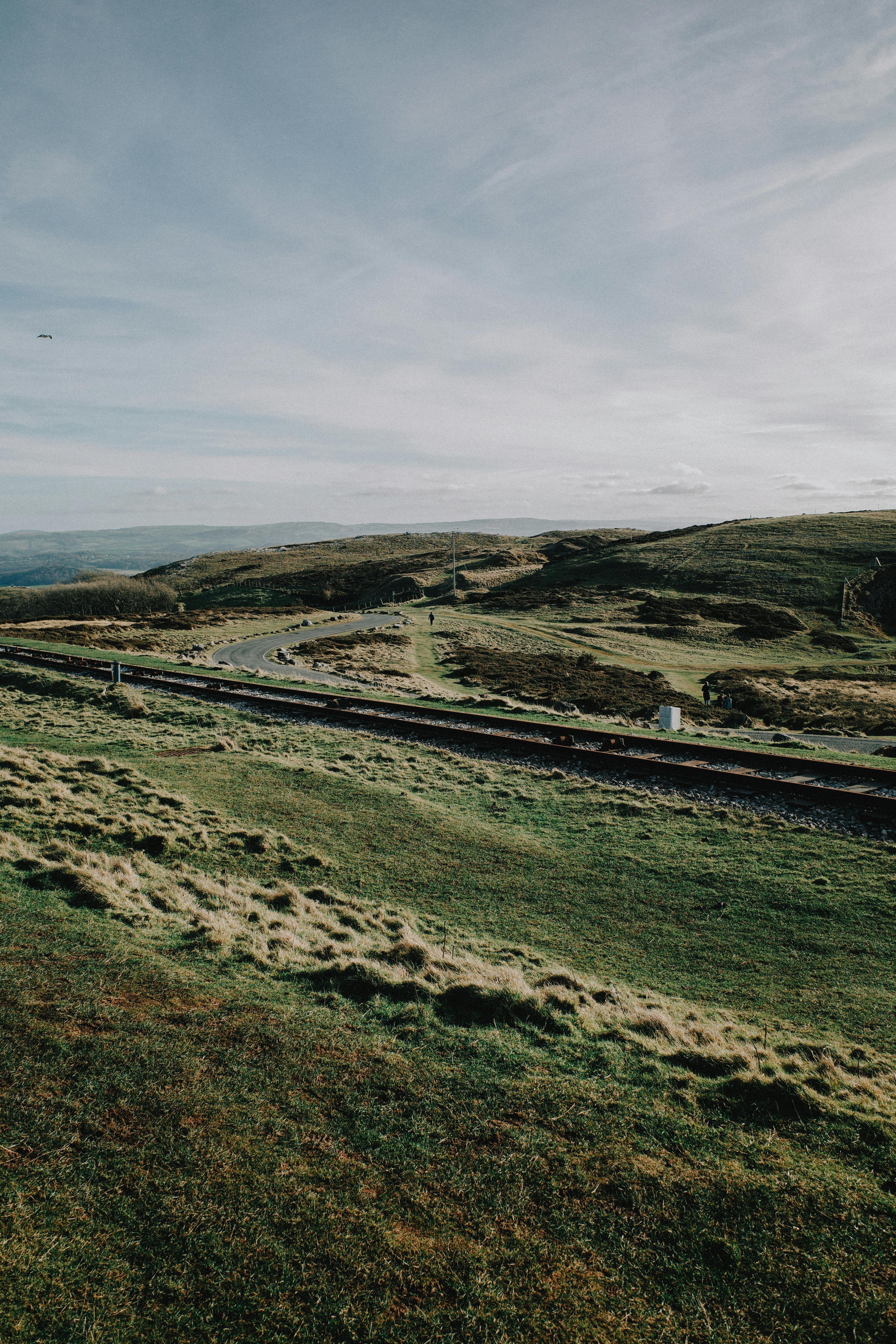 Captivating view of rolling hills and a winding road in Wales, UK.