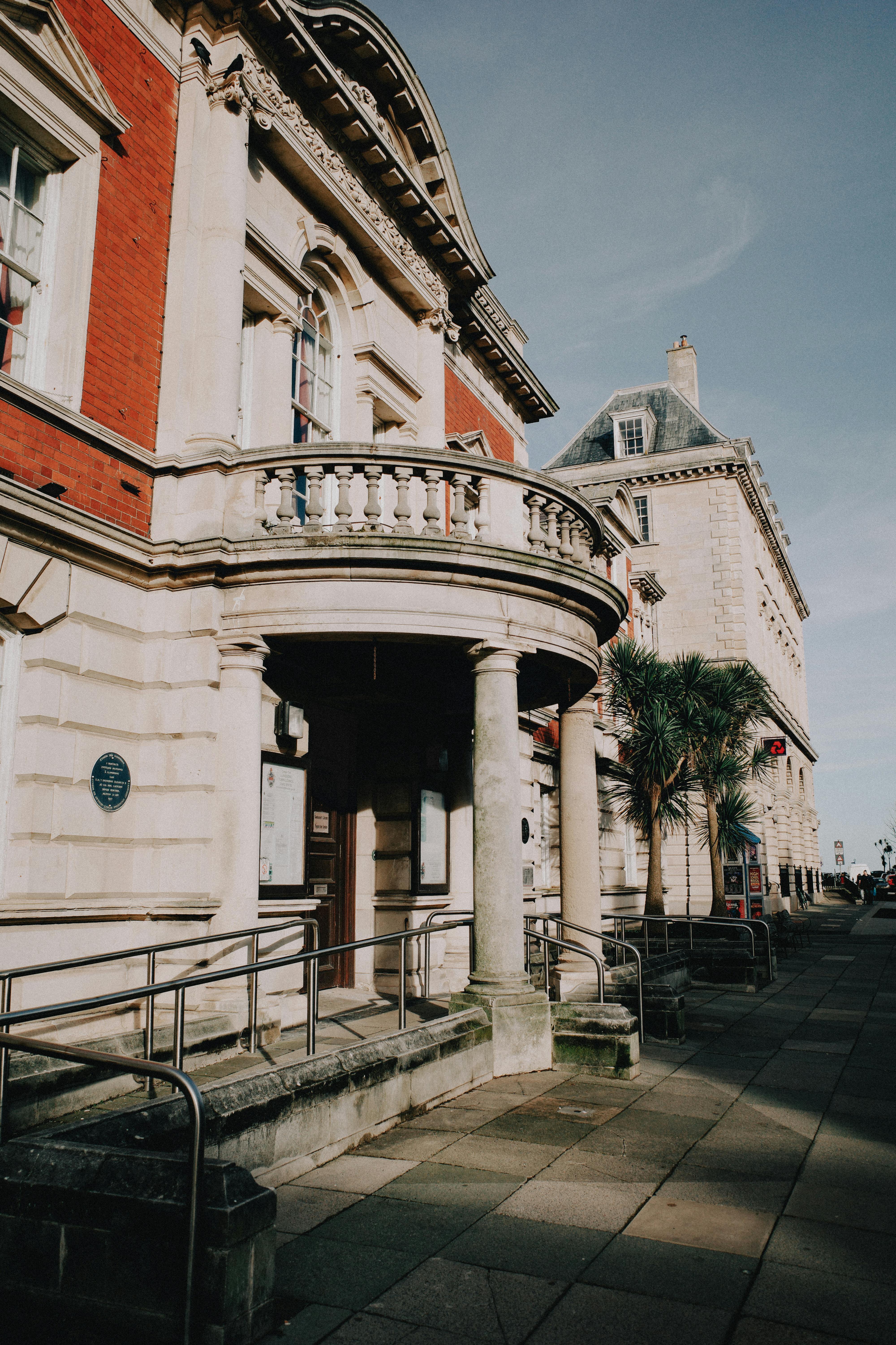 Elegant facade of a historic building in Llandudno, Wales on a sunny day.