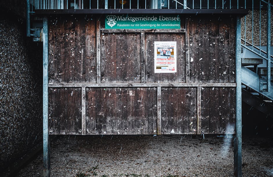 Weathered wooden bulletin board with posters in Ebensee, Austria. - 7 Best cheap Personal Finance Tips strategy near me for busy locals
