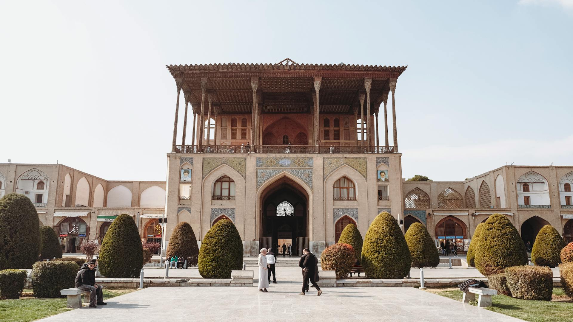 Historic Ali Qapu Palace in Isfahan, showcasing Persian architecture on a sunny day.