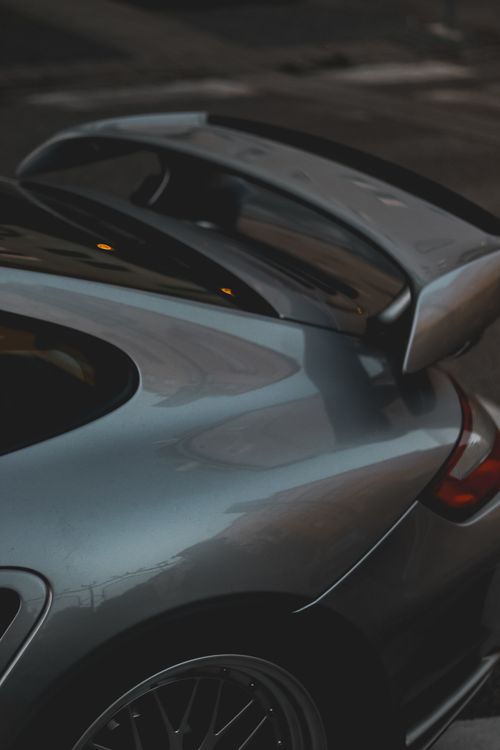 Close-Up of Luxury Sports Car Rear on Road · Free Stock Photo
