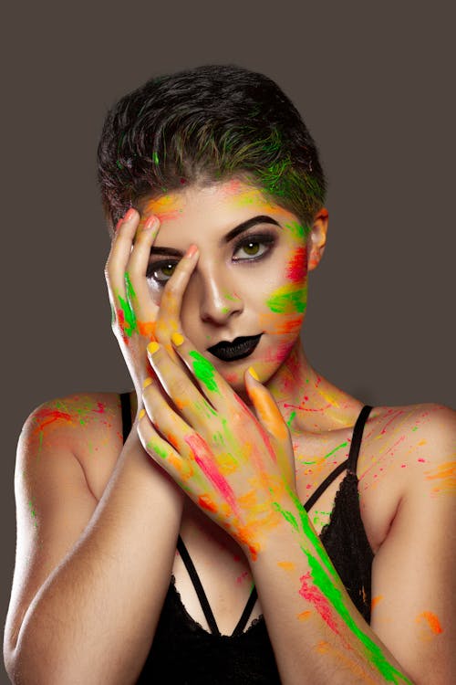 A Portrait a Woman with Paint on her Face and Body