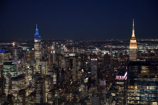 Breathtaking aerial view of New York City skyline at night featuring iconic skyscrapers.