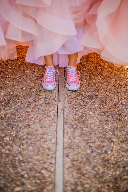 Person Wearing Pink Low-Top Sneakers