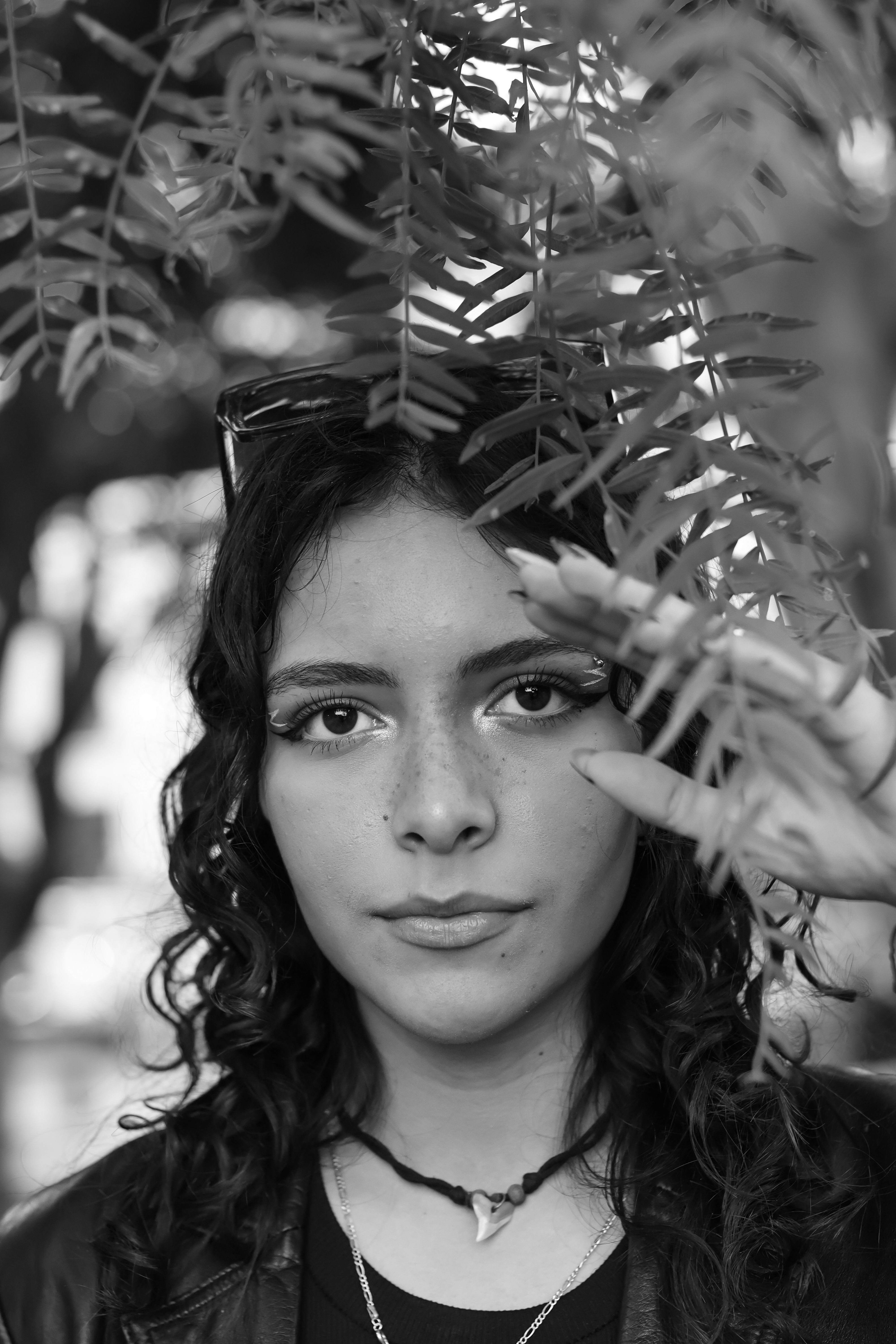 Black and White Portrait of a Young Woman Outdoors · Free Stock Photo