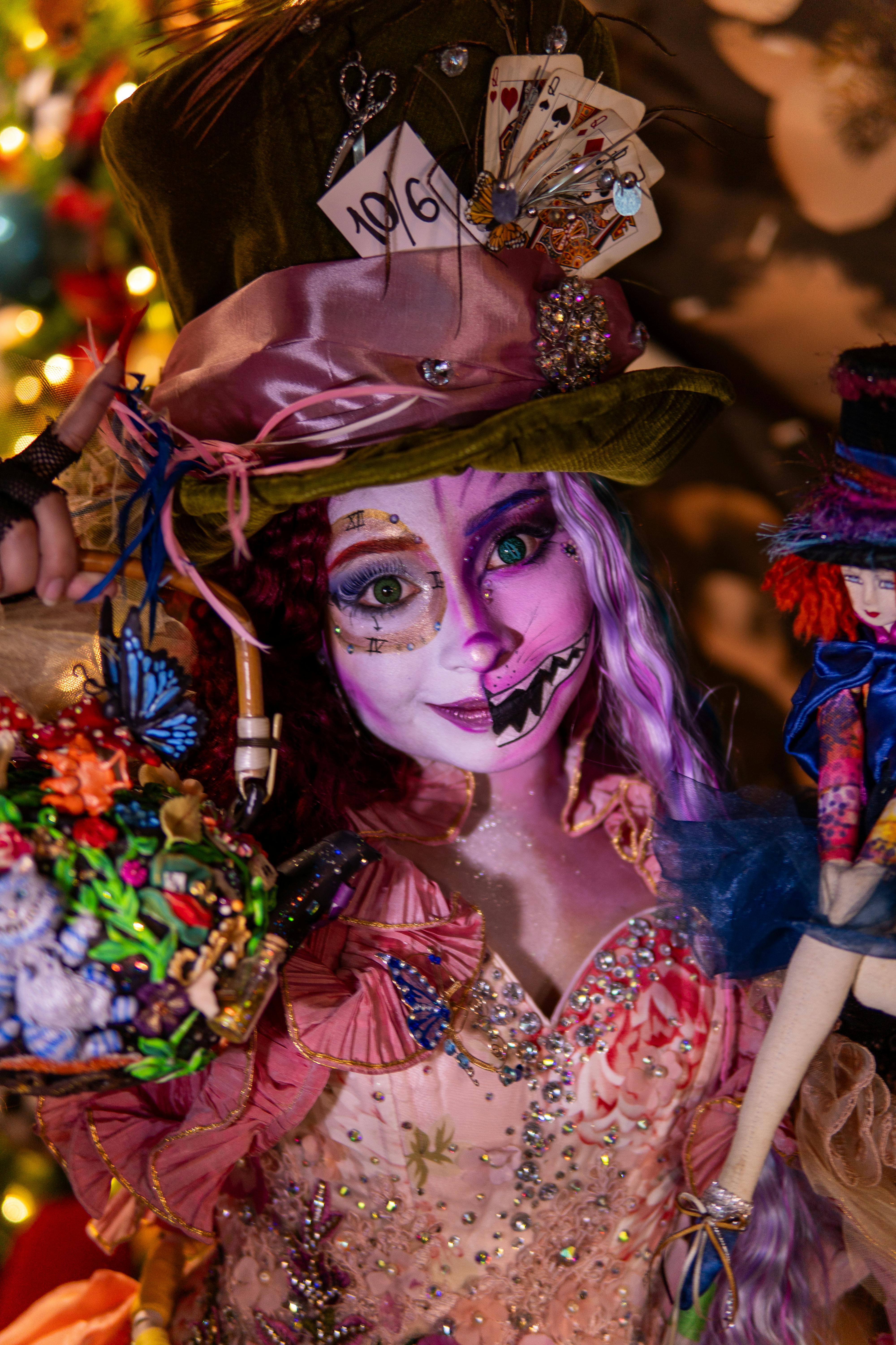 Free Colorful Mad Hatter cosplay featuring intricate makeup and costume detail inspired by Alice in Wonderland. Stock Photo
